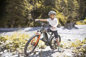 Young Boy riding an Ebike on a Trail