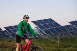 Ebike Rider riding past a solar farm