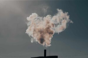 Air pollution from power plant chimneys. Industry and global warming concept