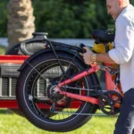 Man putting his folded Heybike Horizon Fat Tire Folding Ebike into his car