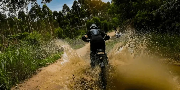 Rider getting wet and dirty on their Boombike Bluvall K6 Fat Tire Electric Bike